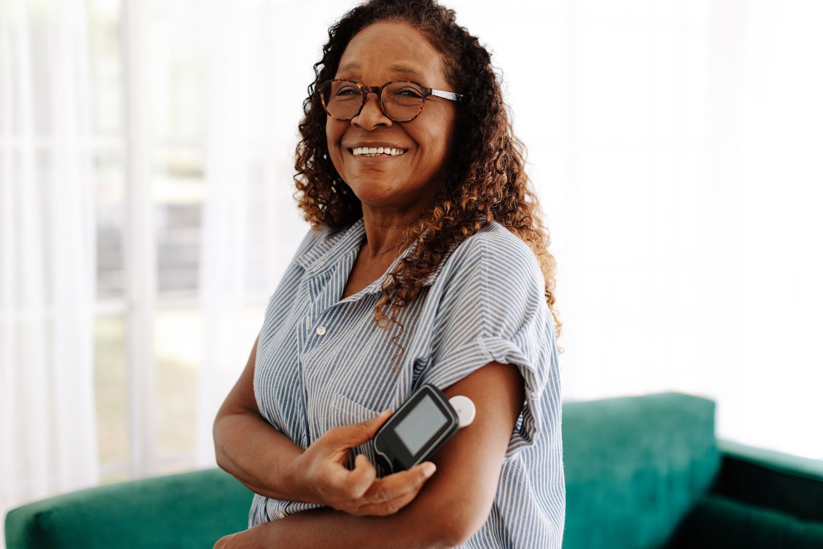 Woman testing with glucose monitor.